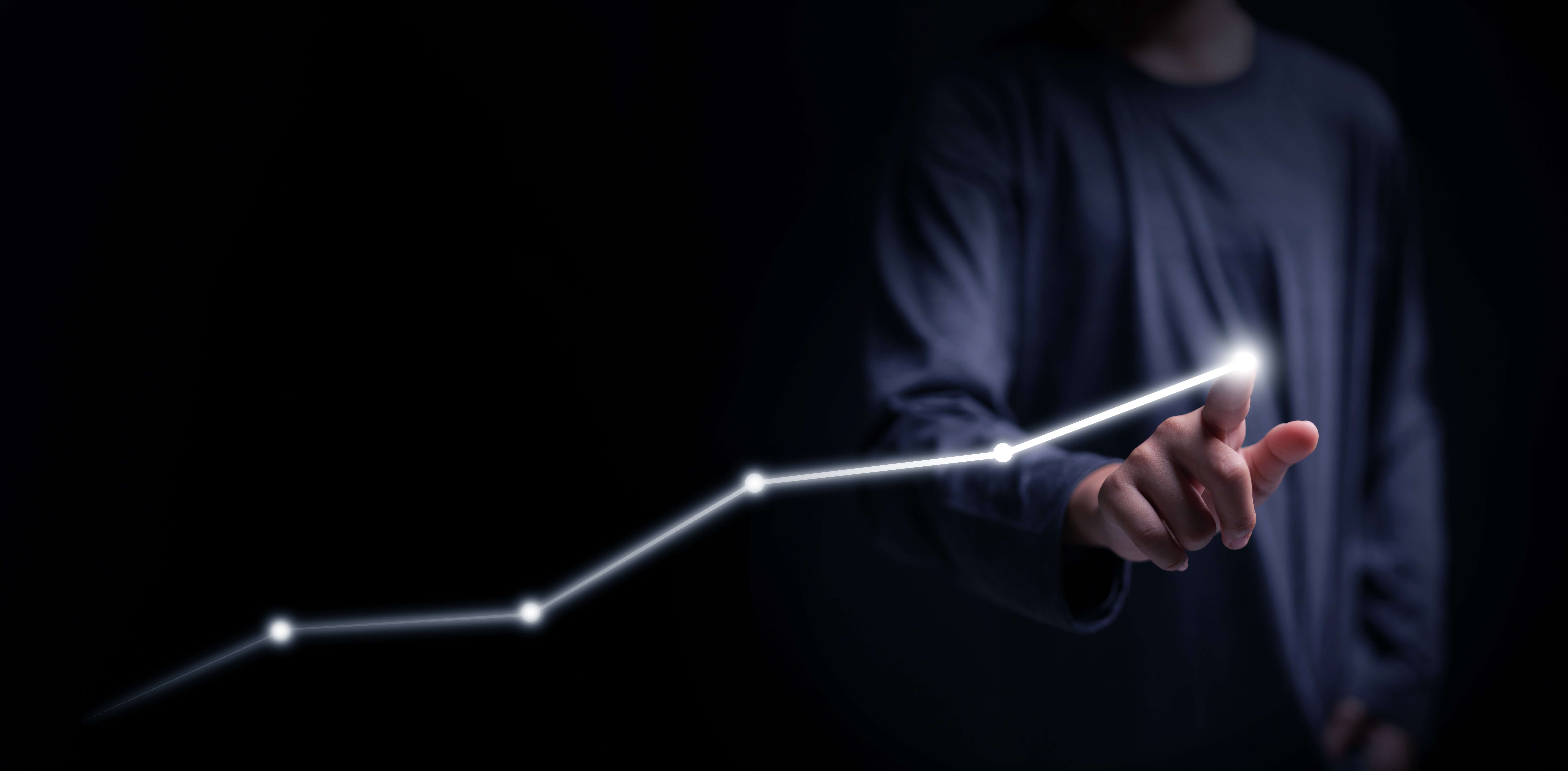 Business growth concept with a glowing rising line chart