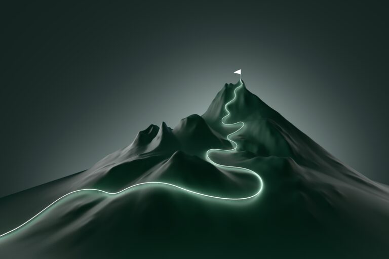 Glowing path leading to flag on peak of mountain