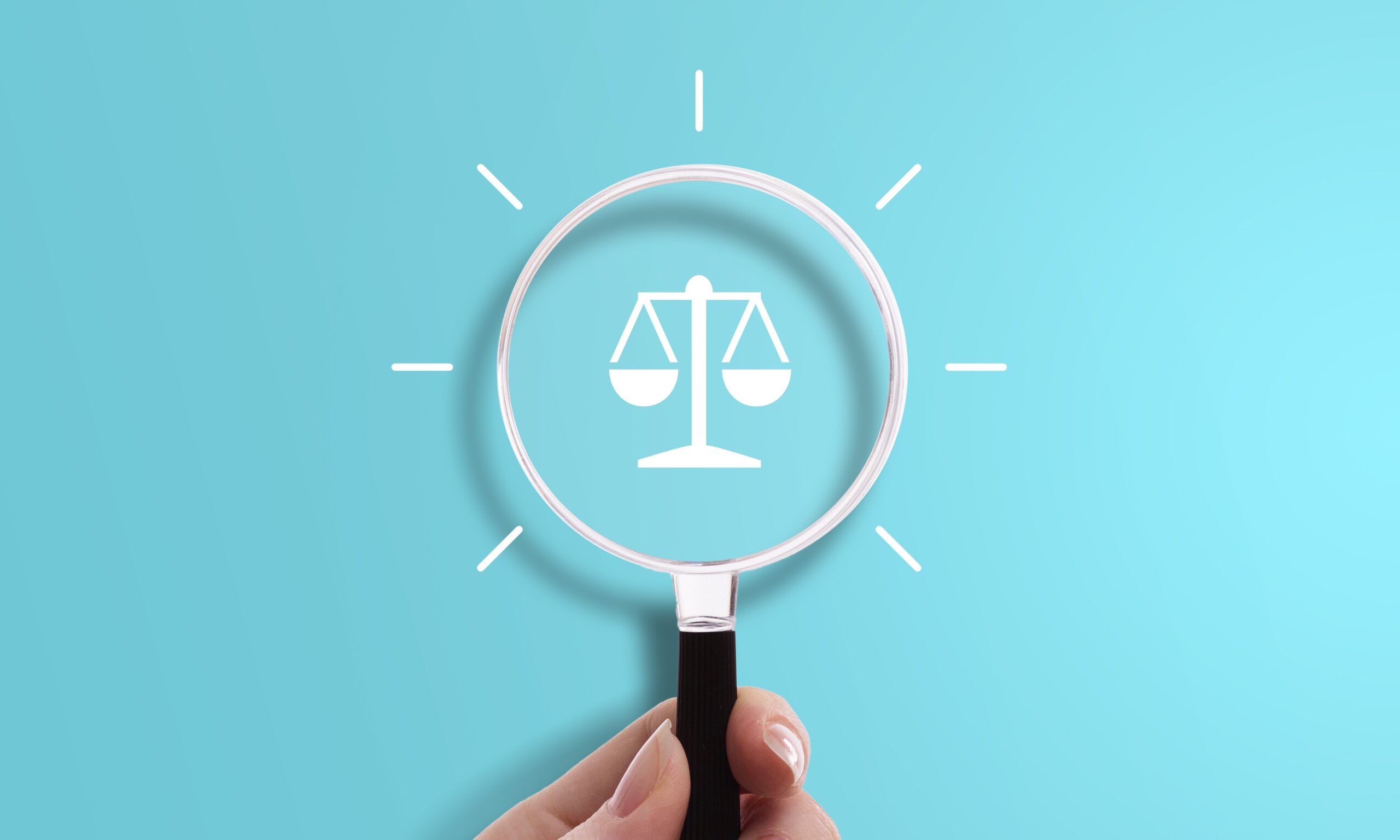 Hand holding magnifying glass with scale icon