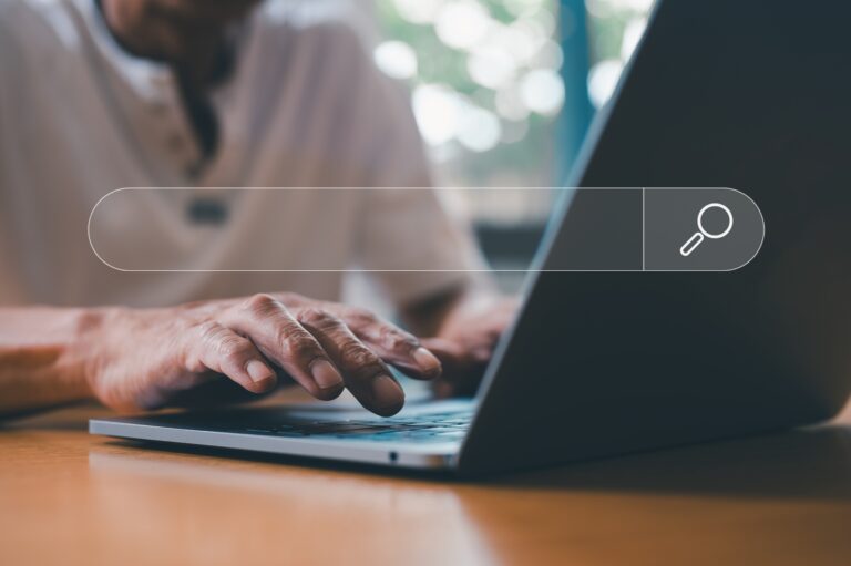 Man using laptop searching information online