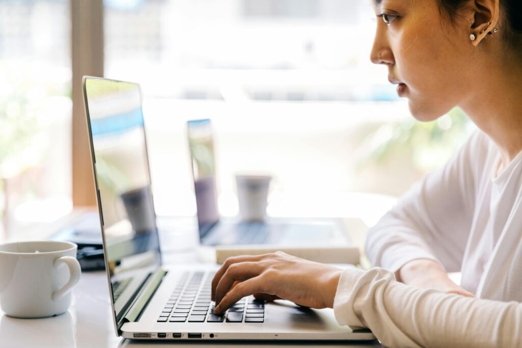 Woman typing on laptop